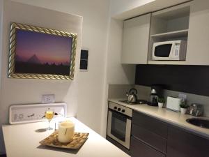 a small kitchen with a table with a candle on it at Soho Apart in Buenos Aires