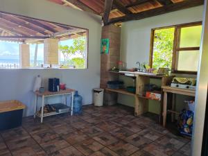 a room with a kitchen with a window and a table at Jimmys cabins in La Periquera