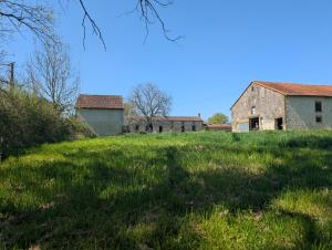 an old farm house on a grassy field at La demeure de vos désirs in Pressac +35 photos
