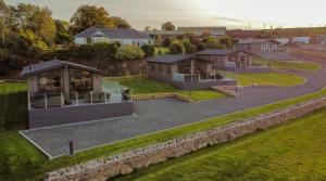 an overhead view of a house with a yard at Drumcarrow Luxury Lodges in St. Andrews