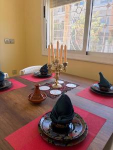 a dining room table with hats on top of it at saidia 700 m de la plage in Saïdia