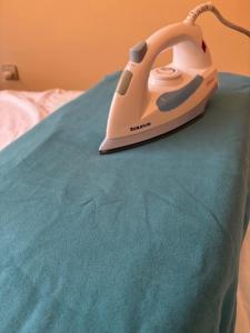 a telephone sitting on top of a bed at saidia 700 m de la plage in Saïdia