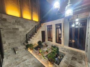 an overhead view of a building with a courtyard with plants at GUZAL Hotel PREMIUM in Bukhara