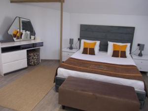 a bedroom with a large bed and a dresser at Sorta Hotel in Antalya +103 photos