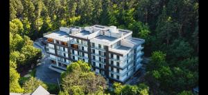 an aerial view of a building in the forest at Nerse's Apartment in Borjomi