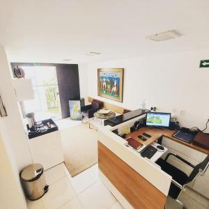an office with a desk with a computer on it at iHostel Aldeota in Fortaleza