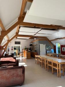 a living room with a long table and chairs at Le Relais Côtier in Sauzon