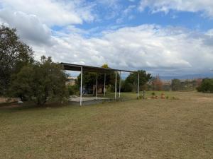 a pavilion in the middle of a field at Tranquility Campsite in Winterton
