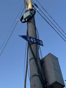 a pole with a street sign on top of it at Appartemani EMIE in Donji Štoj