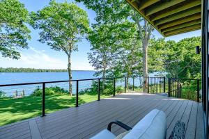a large deck with a view of the water at Modern Ocean Front Home 4 bed, 5 bath Freeport in Freeport