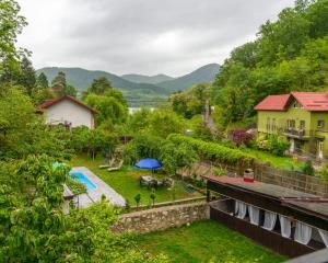 an aerial view of a backyard with a pool and a house at CasaMarinela in Orşova