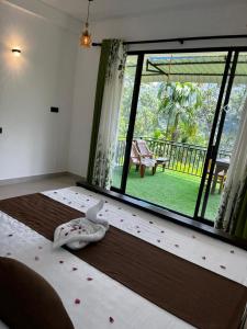 a bedroom with a bed with flowers on the floor at The Aurelian in Ella