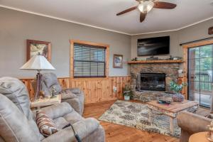 a living room with couches and a fireplace at 2BR Village At Indian Point 501 near SDC-Free Tickets Daily up to $500 in Branson