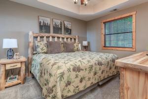 a bedroom with a bed and a window at 2BR Village At Indian Point 501 near SDC-Free Tickets Daily up to $500 in Branson +14 photos