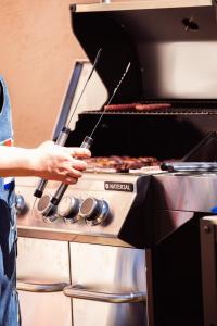a person is cooking food in an oven at Boutique Cortijo Meliora in Cantoria