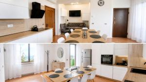 a kitchen and a living room with a table in a room at Casa Katarina Beach Apartment in Silvi Marina