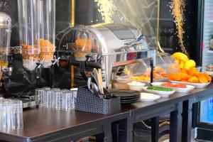 a buffet line with food on a table at Vila Bashkim in Ksamil