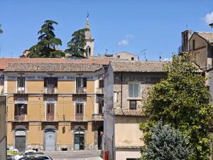 a building with a clock tower on top of it at La Dimora delle Muse in Sulmona