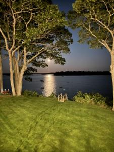 a park with a view of a lake at night at Modern Ocean Front Home 4 bed, 5 bath Freeport in Freeport