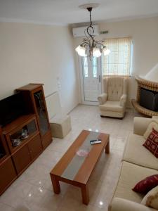 a living room with a couch and a coffee table at Irini's Villa in Argostoli