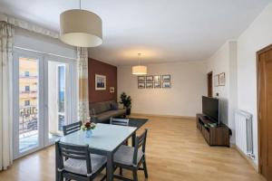 a living room with a table and a couch at Tari Home Crotone in Crotone