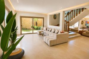 a living room with couches and a table at Villa a cabonegro tetouan in Tétouan +21 photos