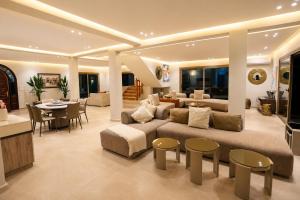 a large living room with a couch and a table at Villa a cabonegro tetouan in Tétouan