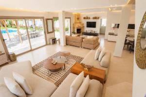 a living room with a couch and a table at Villa a cabonegro tetouan in Tétouan