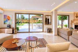 a living room with a couch and a table at Villa a cabonegro tetouan in Tétouan