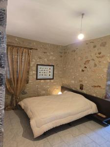 a bedroom with a large bed in a room at Mani Spot by the Sea in Gerolimenas