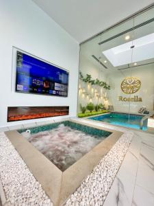 a swimming pool in the middle of a house at Rosella Chalet in Jabal Al Akhdar