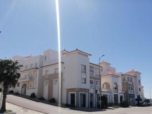 a row of apartment buildings on a street at Al Hoceima Hay Bades Villa in Al Hoceïma