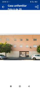 a screenshot of an apartment building with a car parked in front at Casa unifamiliar in Seville