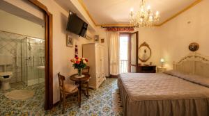 a bedroom with a bed and a bathroom at Affittacamere Al Gattopardo Favignana in Favignana