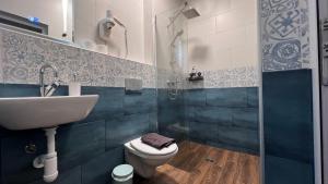 a bathroom with a sink and a toilet and a shower at Alice house in Sofia +134 photos