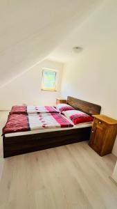 a bedroom with a bed in a room at Chata u Studnaře in Křivoklát