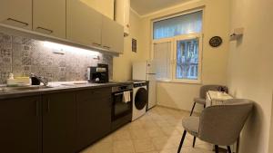a kitchen with a sink and a dishwasher at Alice house in Sofia