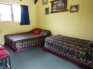 Letto o letti in una camera di Glow Worm Accommodation