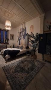 a bedroom with a bed and a rug on the floor at Melita Living in Sliema +45 photos