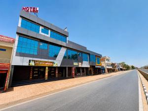 an empty street in front of a building at Radha Krishna Hotel in Karauli