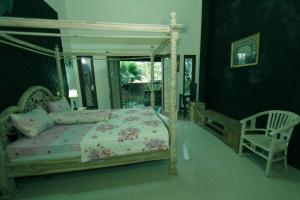 เตียงในห้องที่ Villa Dayins