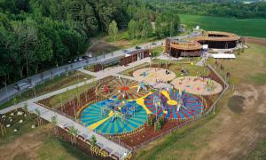 an aerial view of a carnival park with colorful umbrellas at Apartament nad bulwarem in Lidzbark Warmiński