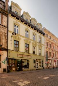 a building on the side of a street at Jainty Apartments Bytom in Bytom