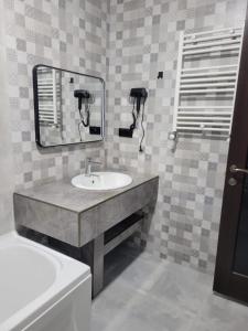 a bathroom with a sink and a mirror at Nike aghmashenebeli str 158 in Kobuleti +110 photos