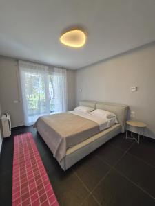 a bedroom with a large bed and a table at Peonia Villa ValaMar in Draç +68 photos