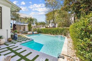 a swimming pool in the backyard of a house at Serenity Now in Rosemary Beach