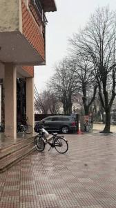 a bike parked on the side of a building at Duomo Apartament in Shkodër