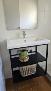 a bathroom with a sink and a mirror at La Sènia in Miravet +7 photos