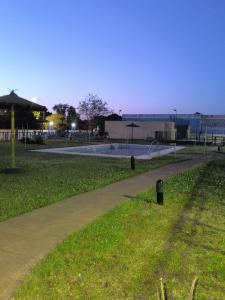 a path in a park at night with a pool at Lux Sevilla Elegance in Seville