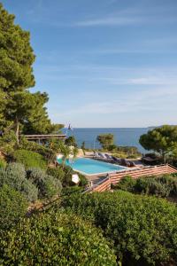 a swimming pool with the ocean in the background at Villa Irini in Porto Heli